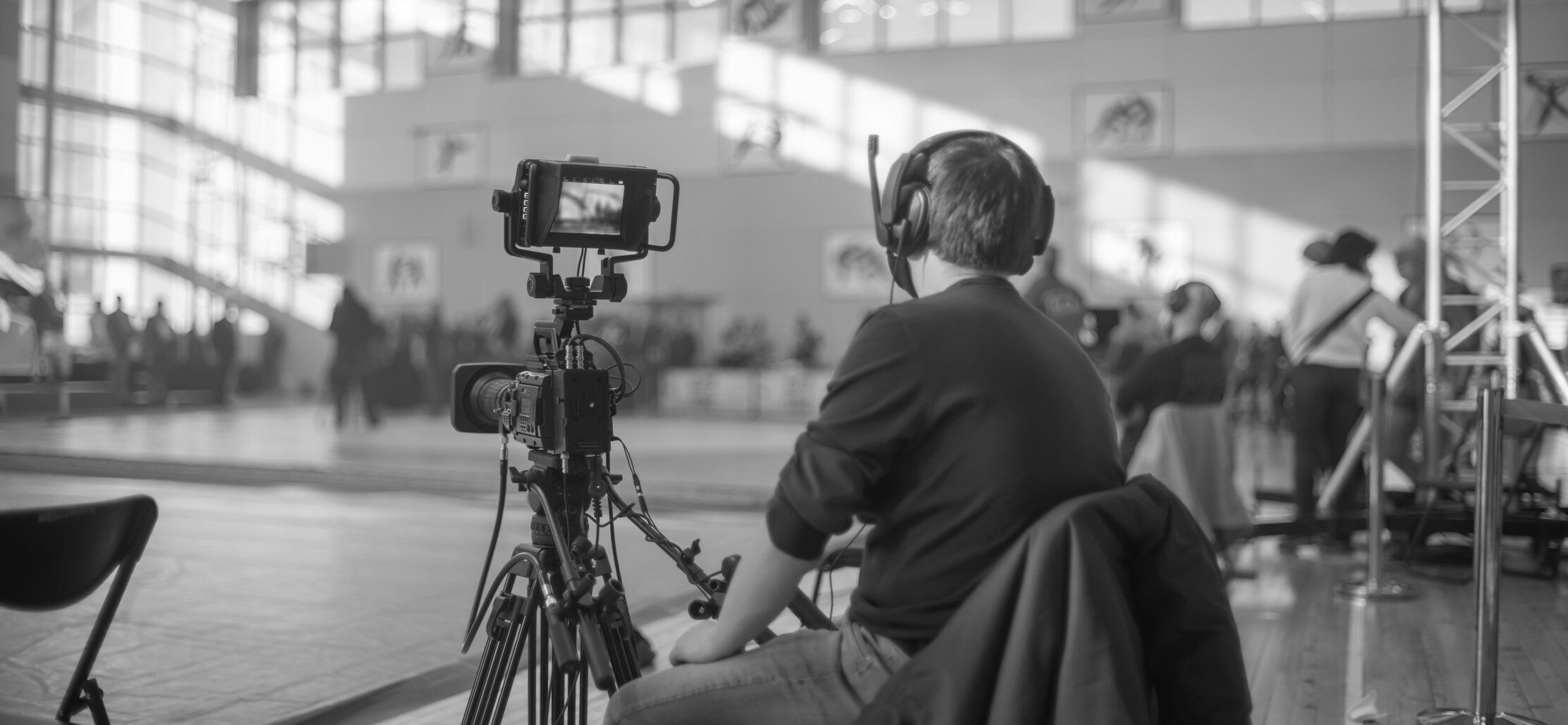 Masked Operator Shoots a Stream. Sports Event